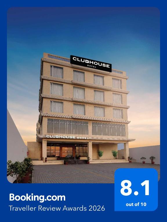 a hotel building with a sign on top of it at Clubhouse Hotel Morbi by CheckIn in Morbi
