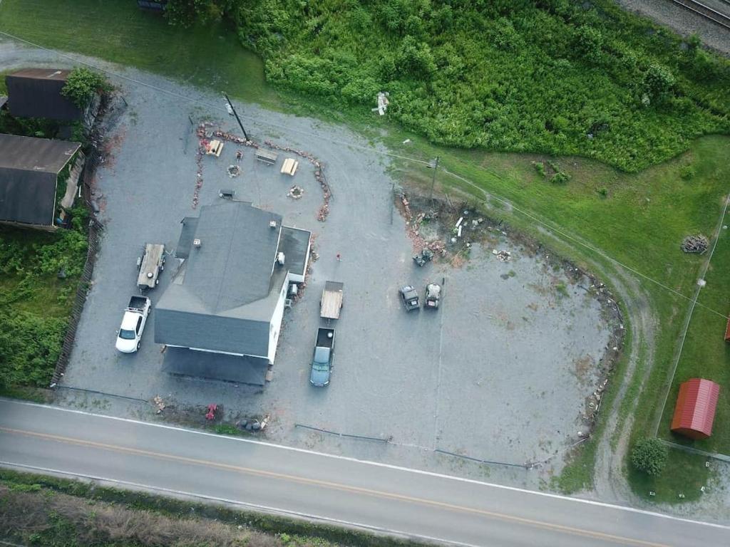 an aerial view of a parking lot with cars at Cottage 5 Duplex in Eckman ATV Fun and Rentals! in Northfork