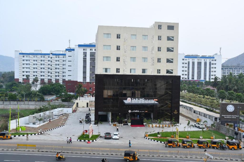 a large building in the middle of a city at Darling Grand SME in Vellore