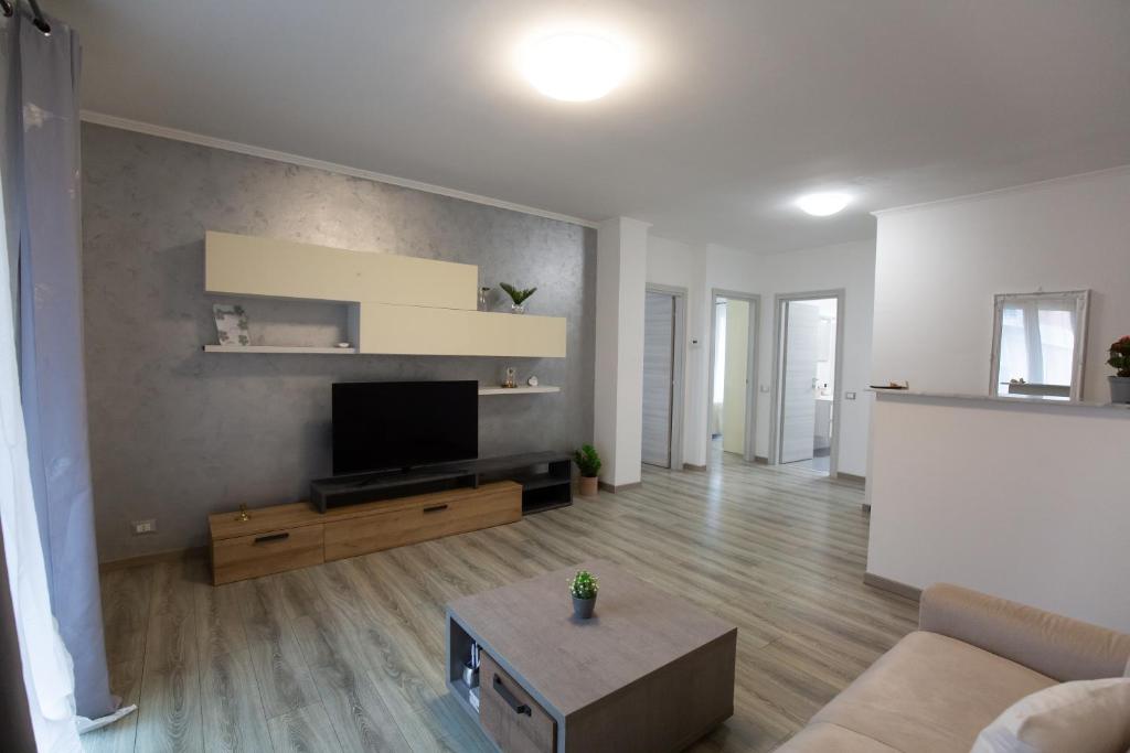 a living room with a flat screen tv on a wall at Casa Serena in Rivarolo del Re ed Uniti
