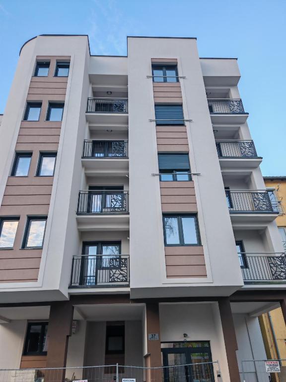 an image of an apartment building with balconies at Apartman Ivana in Kraljevo