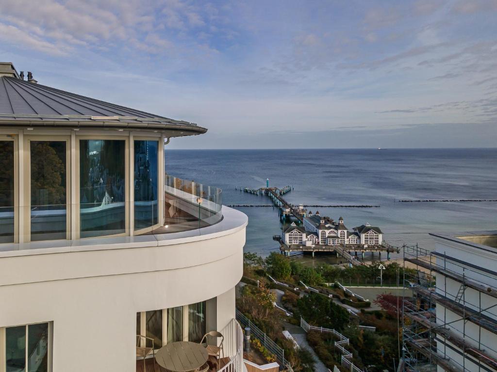 a view of the ocean from the balcony of a building at THE BALTIC VIEW Sellin in Ostseebad Sellin