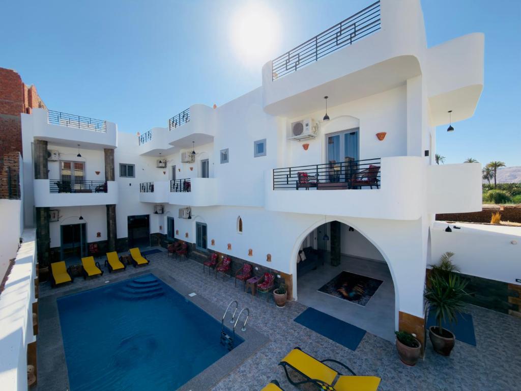 a view of a house with a swimming pool at Azure Guest House in Luxor