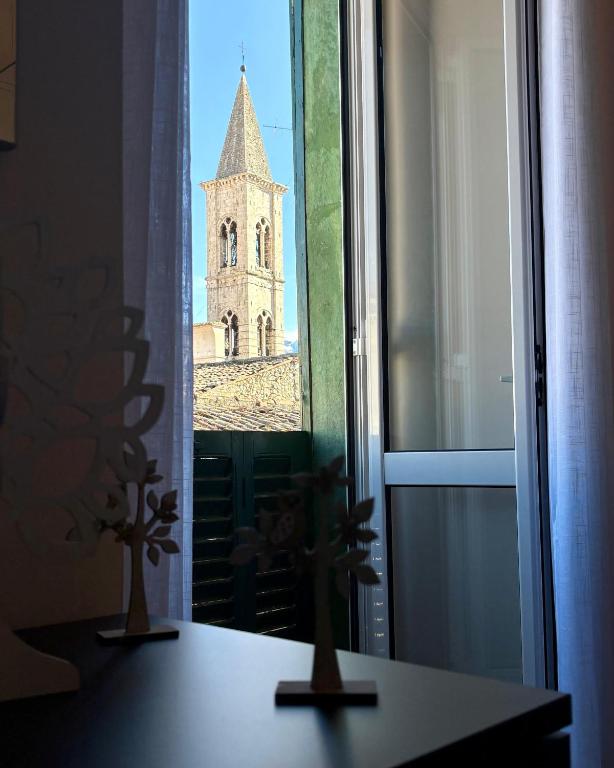 a view of a church seen through a window at Corso Ovidio - Casa vacanze in Sulmona