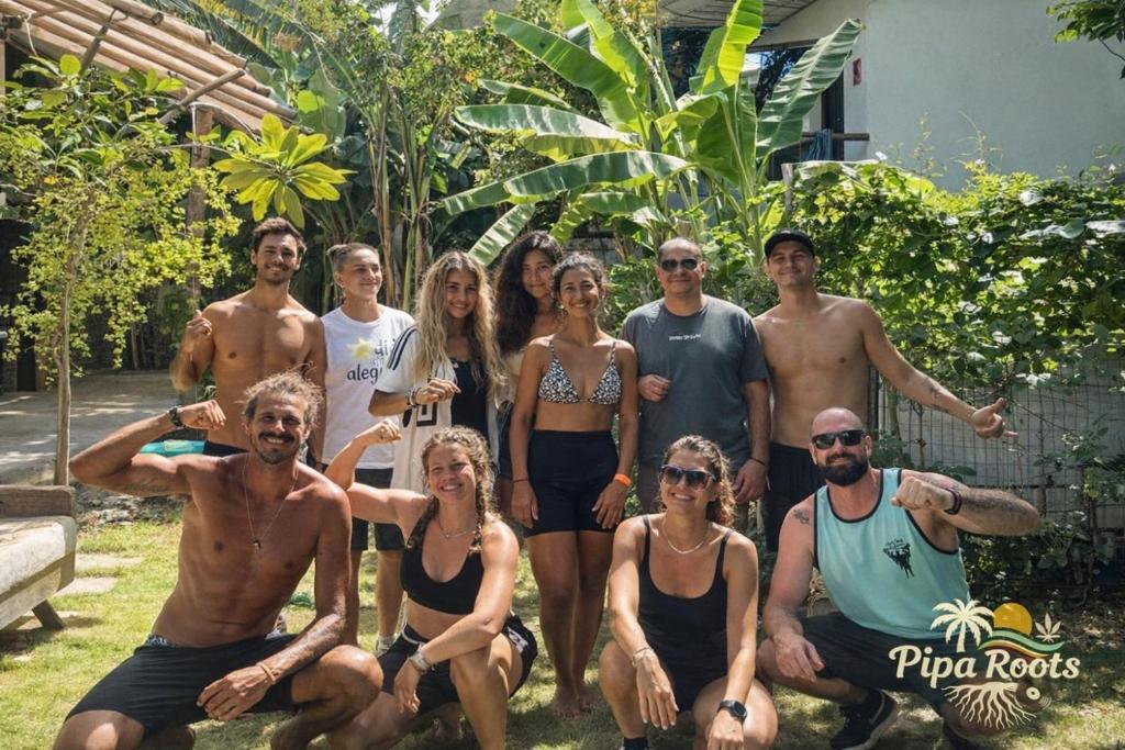 a group of people posing for a picture at Pipa Roots Hostel in Pipa