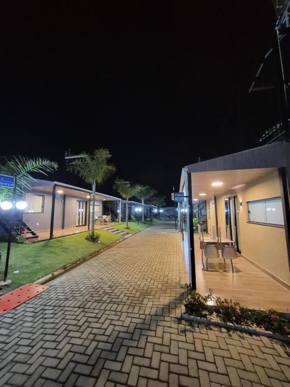 a cobblestone street at night with a building at Chalés - Aquabeat in Sao Jose da Lapa