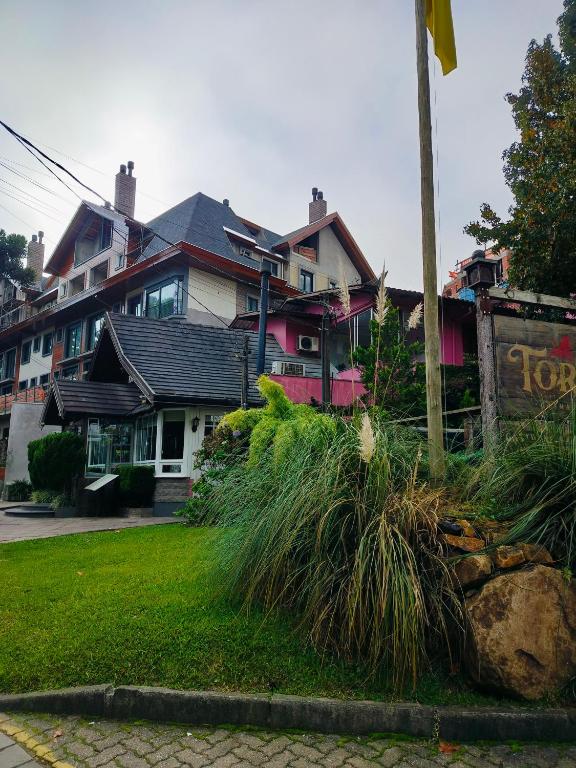 a group of houses on the side of a street at Pousada Centro in Gramado
