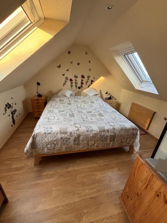 a bedroom with a large bed in a attic at Ferienwohnung Hocke in Wulfsen