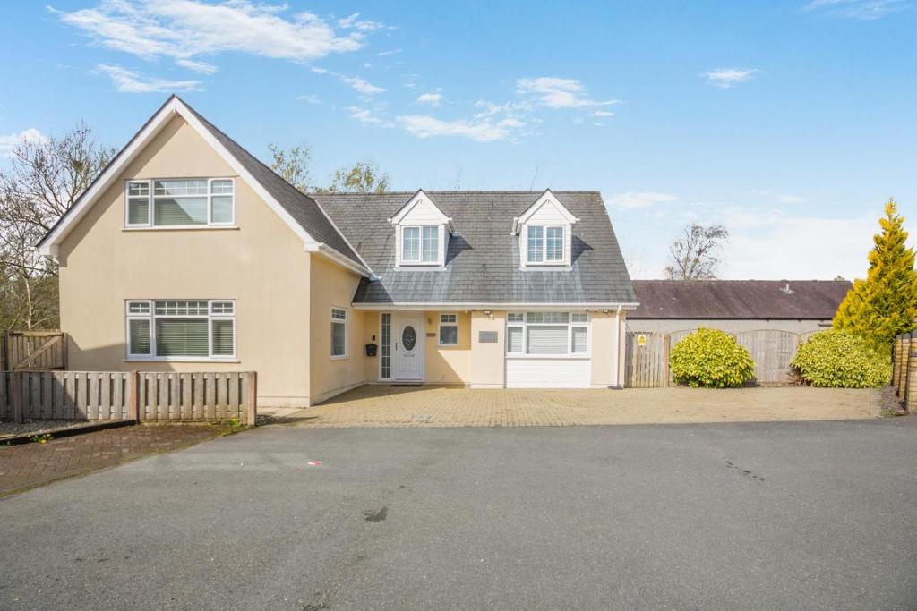 a large house with a driveway at 4 Bed in Caernarfon oc-86423 in Pen-y-groes