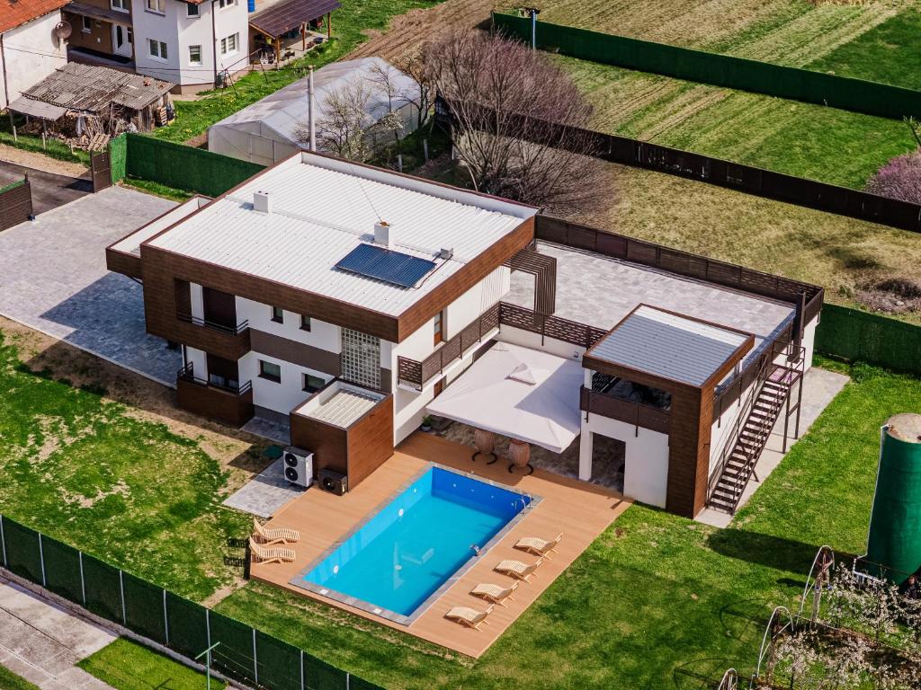 an overhead view of a house with a swimming pool at Villa Sunce in Visoko