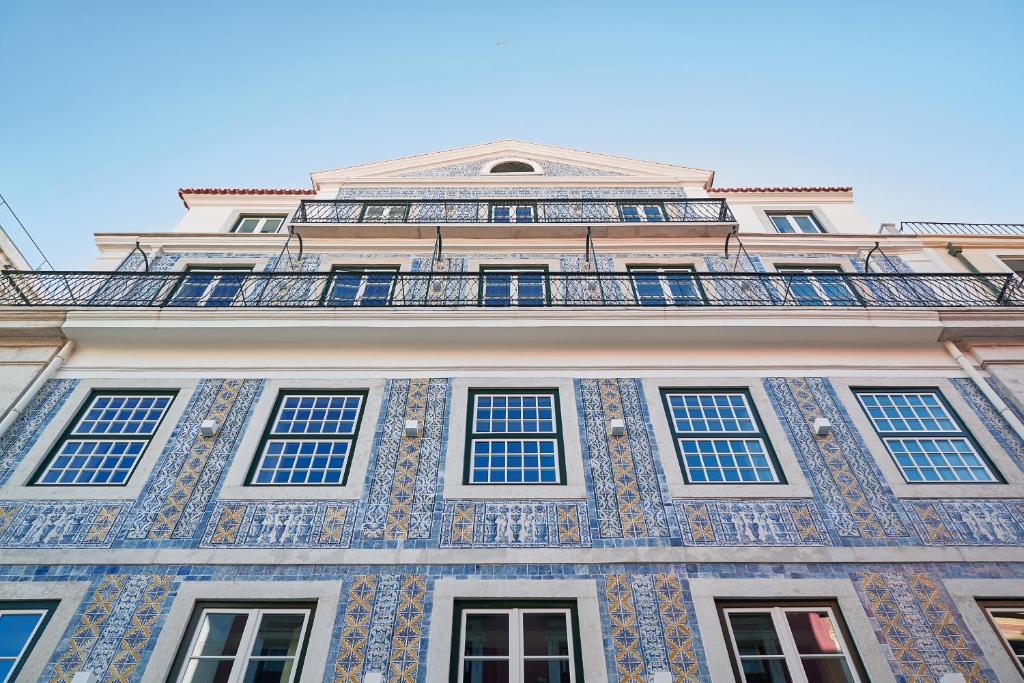 a tall building with a lot of windows on it at Europe Lisboa Boutique Hotel in Lisbon