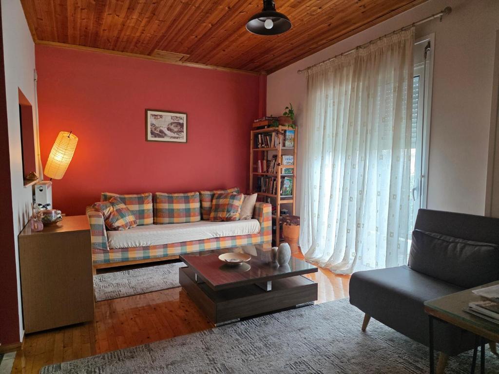 a living room with a couch and a table at Cosy apartment in Sparta in Sparta