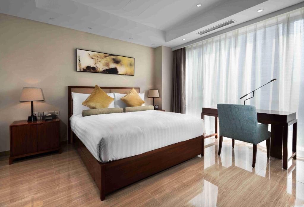 Postel nebo postele na pokoji v ubytování Oakwood Hotel & Residence Suzhou