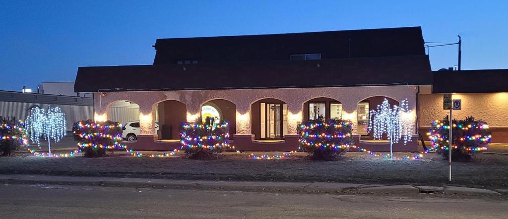 a house with christmas lights on the front of it at Colonial Inn in Brandon