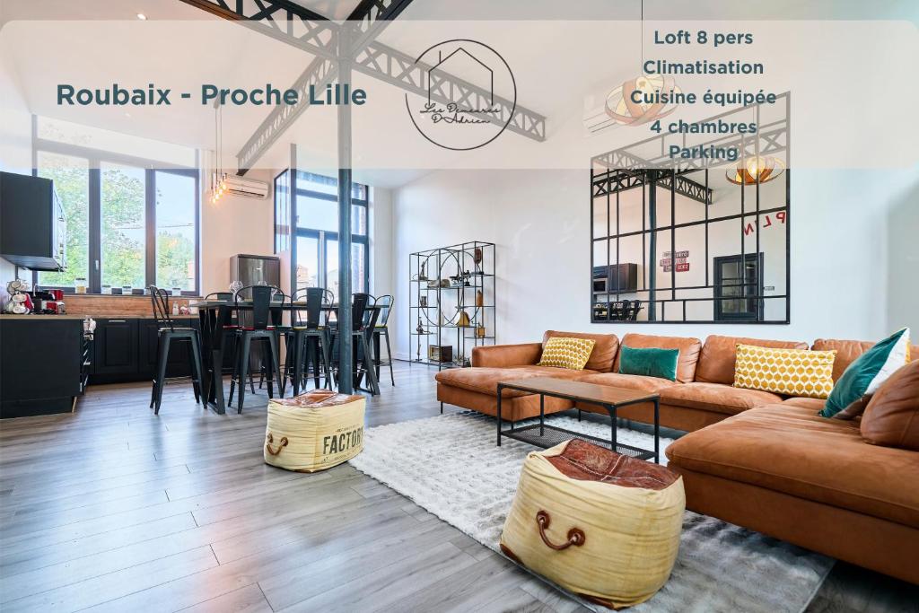 a living room with a couch and a table at Le Charlie Chaplin - Loft d'exception, 8 pers in Roubaix