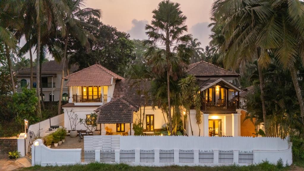 a house with a white fence in front of it at Forsté Arcangela, Sangolda in Sangolda