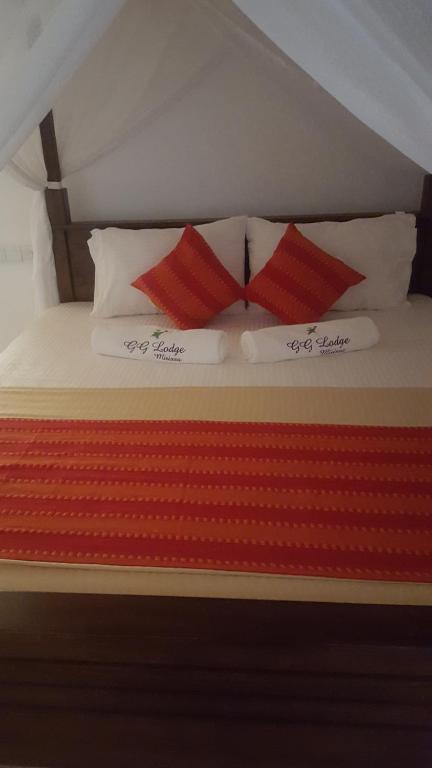 Postel nebo postele na pokoji v ubytování GG Lodge Mirissa