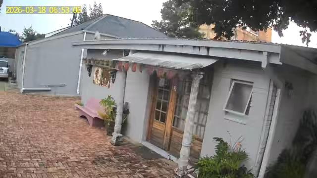 a small white house with a door on a brick yard at Uncle Charlie in Kroonstad