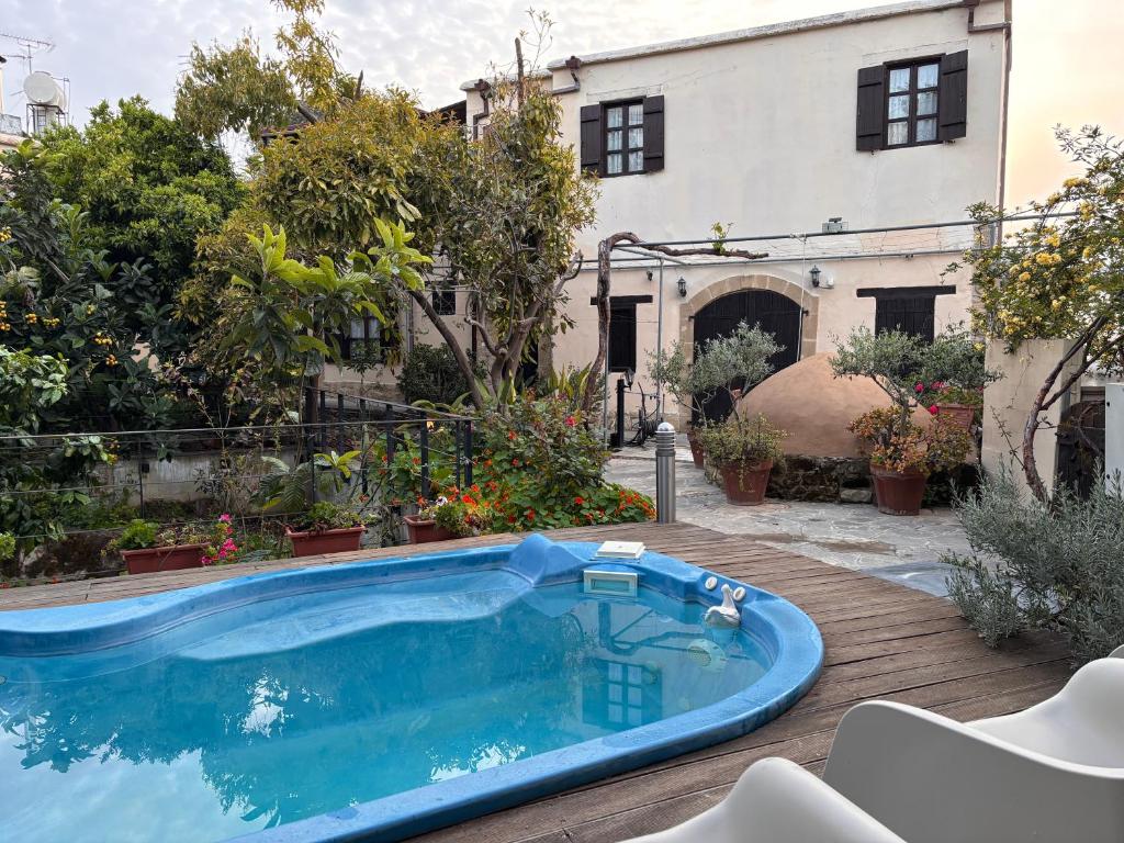 a swimming pool in the yard of a house at Vasilion Agrotourism in Polis Chrysochous