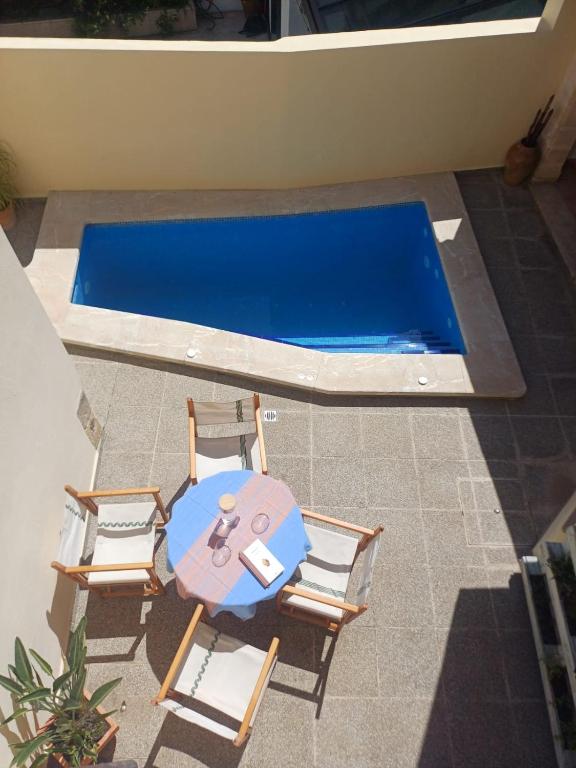 an overhead view of a table and chairs next to a swimming pool at Casa Alacantí in Pollença