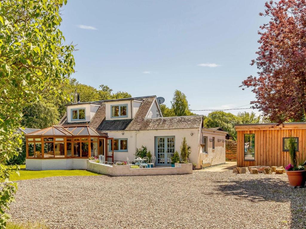 a house with a large driveway in front of it at 3 Bed in Crieff oc-88631 in Comrie
