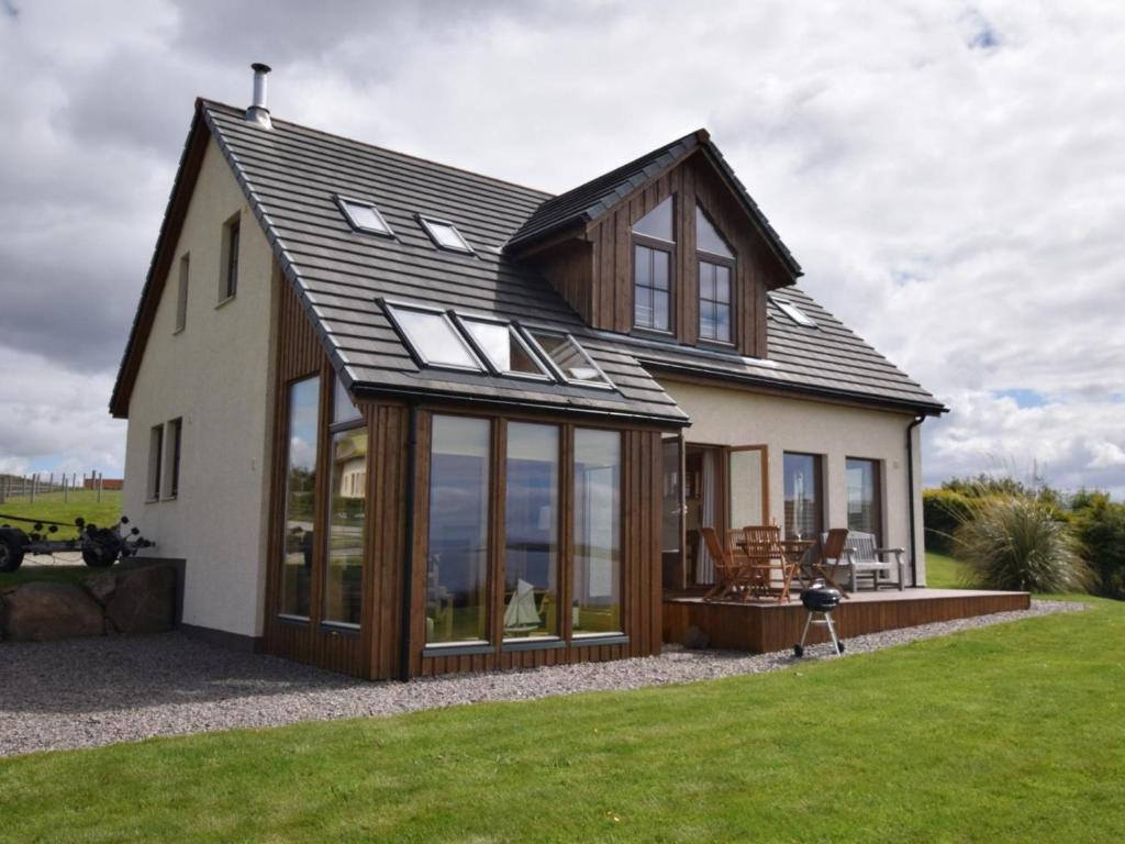 a house with large windows on the side of it at 4 Bed in Gairloch oc-29010 in Gairloch