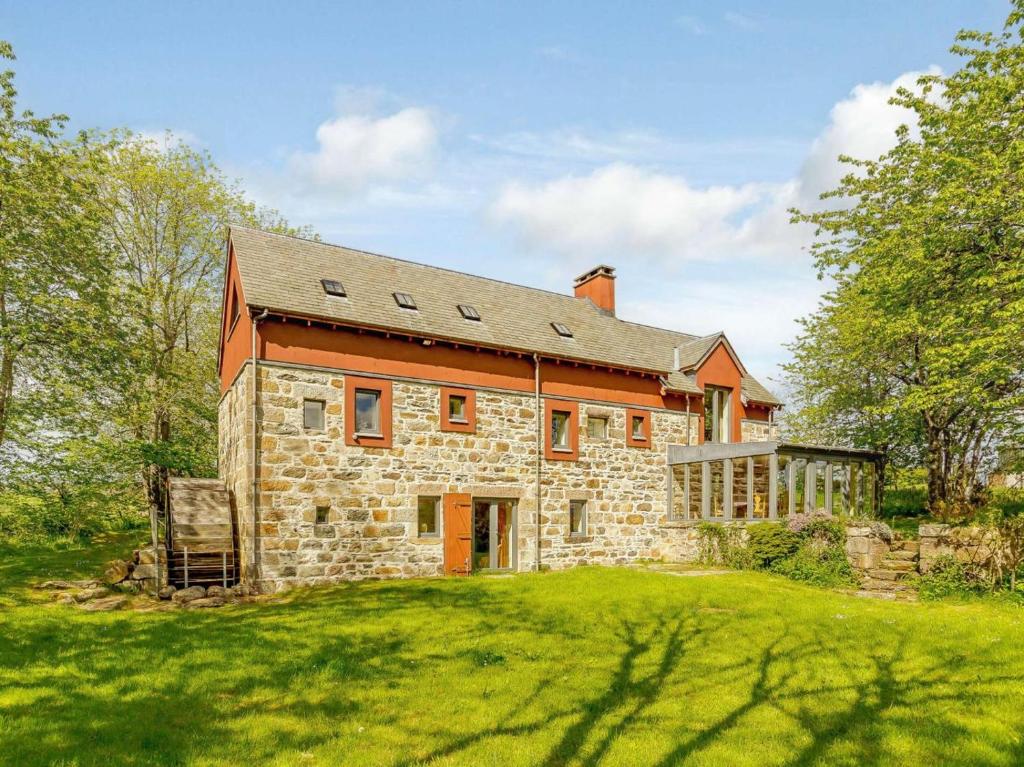 an old stone house with an orange roof at 5 Bed in Aberlour oc-ca280 in Carron