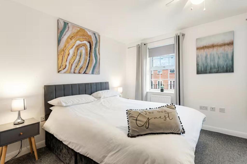 a bedroom with a bed with a pillow on it at Charming 3-Bedroom Norwich Retreat Garden& Parking in Norwich