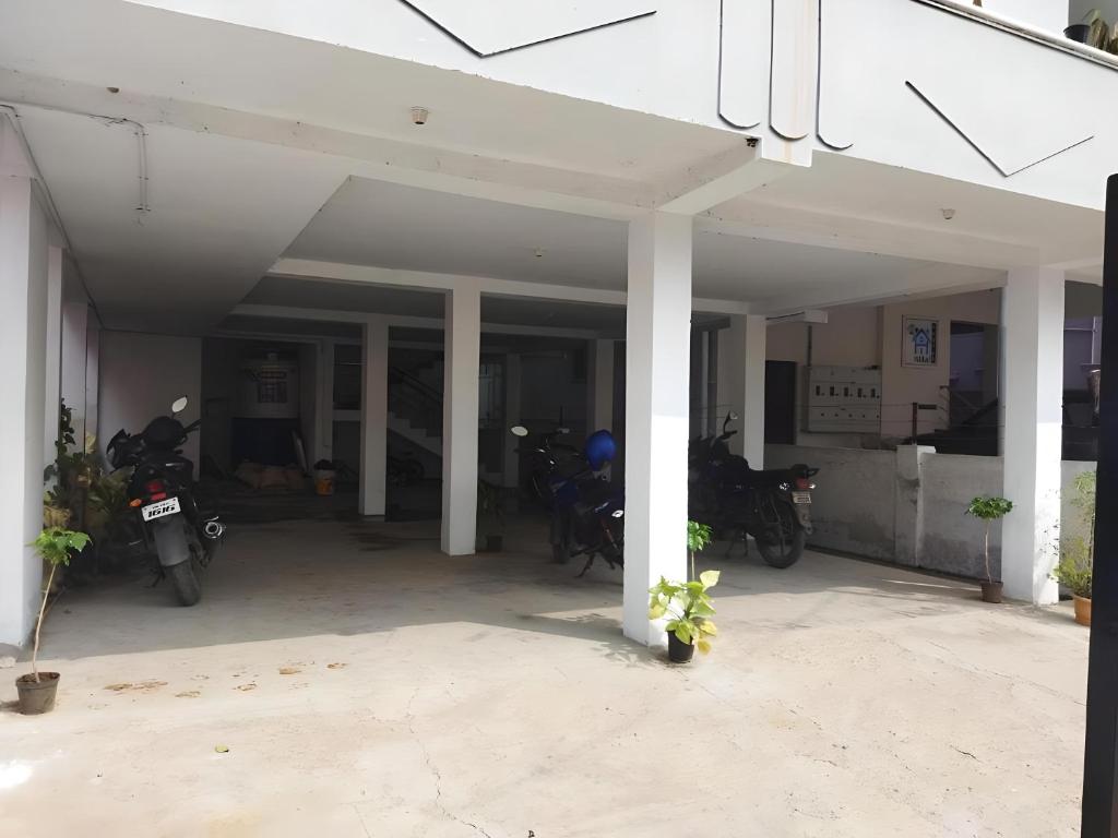 a garage with motorcycles parked inside of it at WooLiv in Coimbatore