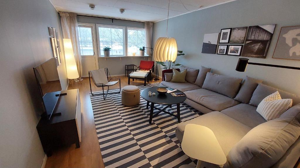 a living room with a couch and a table at 2 Bedroom apartment close to Branäs Resort - Likemovägen 12B in Likenäs