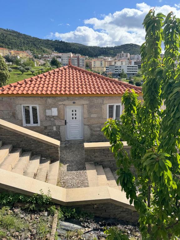 a small building with a red roof at Casa da Prima in Torre de Moncorvo
