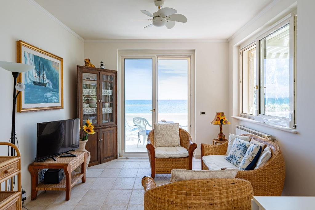 a living room with a view of the ocean at Villa Claudia - YourPlace Abruzzo in Termoli