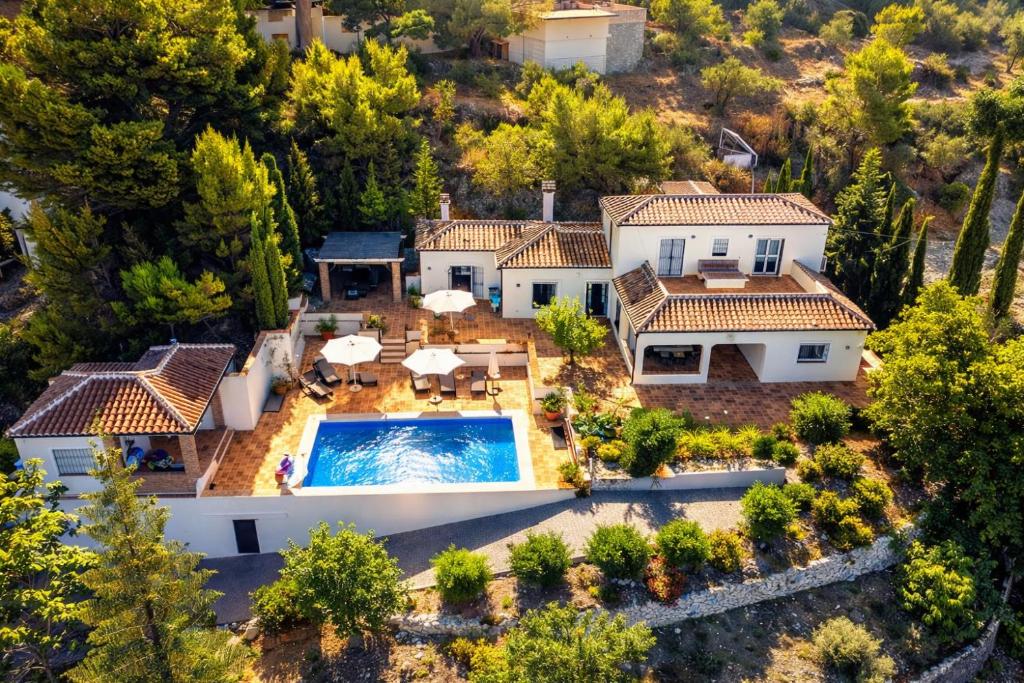 an aerial view of a house with a swimming pool at Villa Atréju in Cómpeta