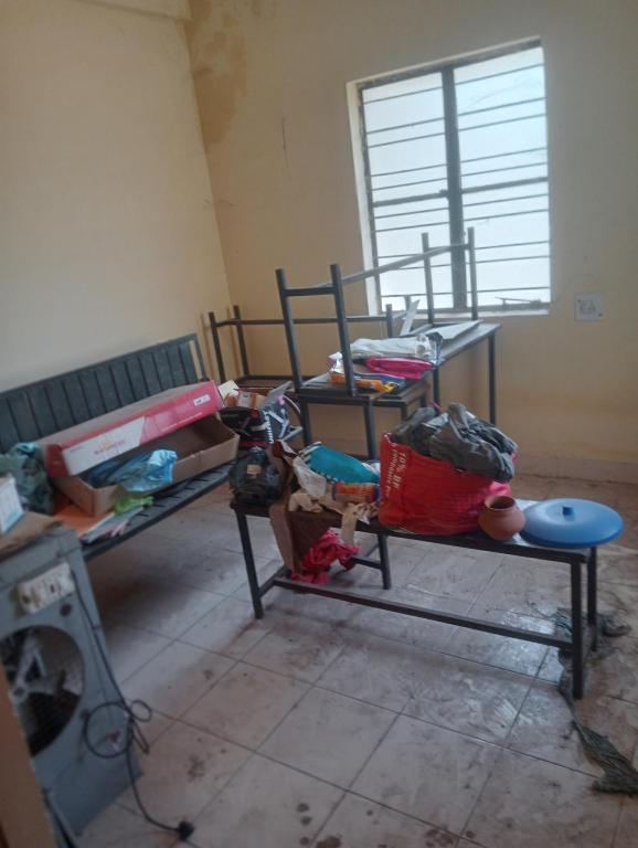 a room with two bunk beds and a window at Parijat Talpuri rishali in Durg
