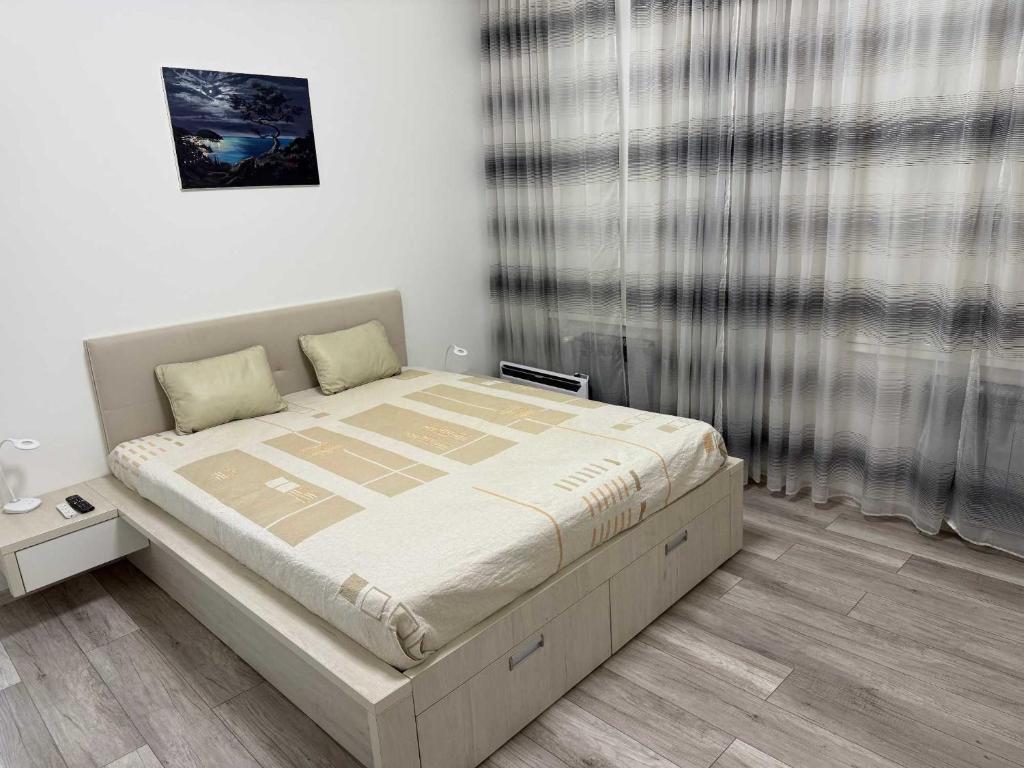 a bedroom with a large bed in a room at Chirons Rest in Volos