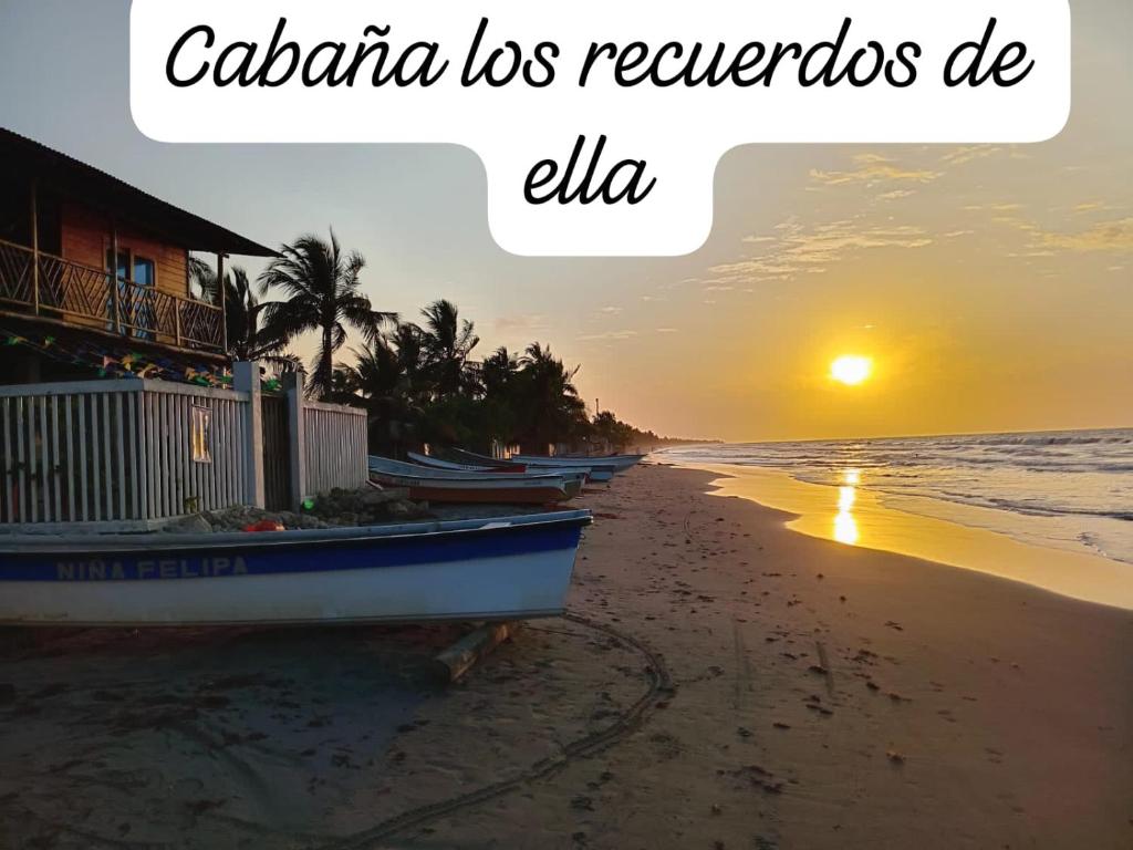 a picture of a beach with a boat on the sand at Cabaña los recuerdos de ella in Moñitos
