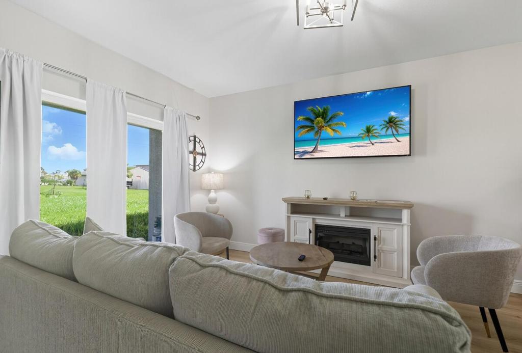 a living room with a couch and a fireplace at Chic 3BR, 2BA -Brand New! in Englewood