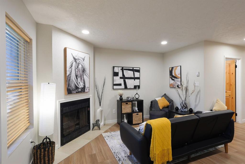 a living room with a couch and a fireplace at Luxuriously Contemporary Condo WL1401 Powder Mtn in Eden