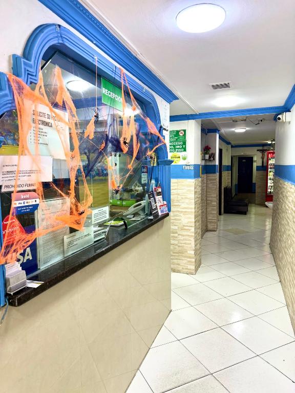 a store with a large aquarium in the hallway at Hotel Sol y Luna 1 in Medellín