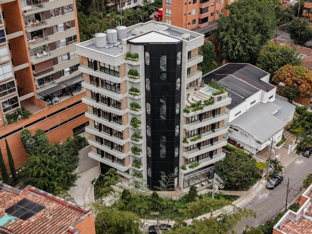 an overhead view of a tall white apartment building at Lomm By Somos The Group in Medellín