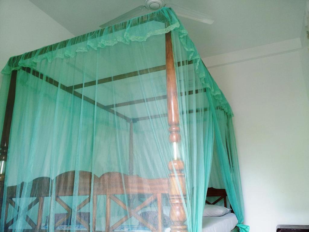 Postel nebo postele na pokoji v ubytování Rainbow Guest House