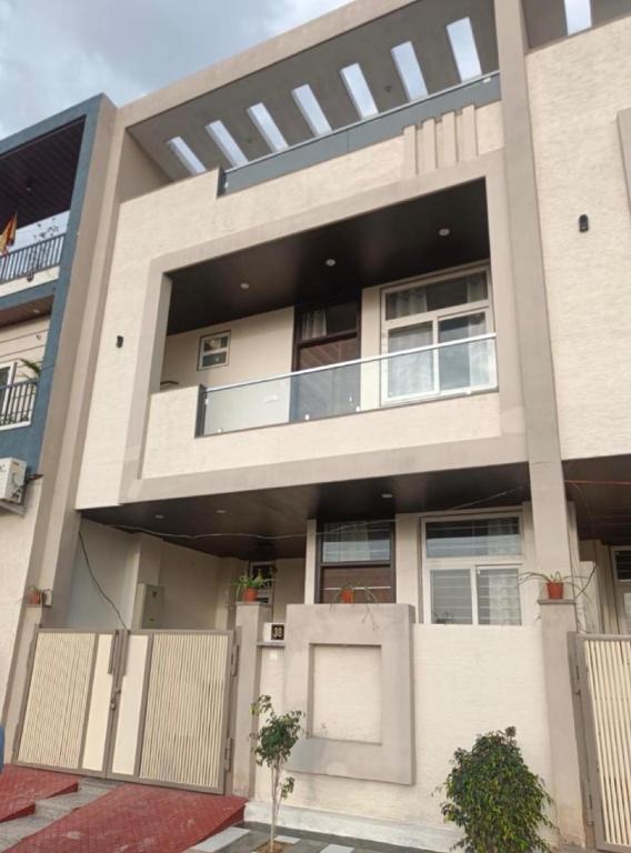 a large white building with a lot of windows at Elegant villa getaway in Jaipur