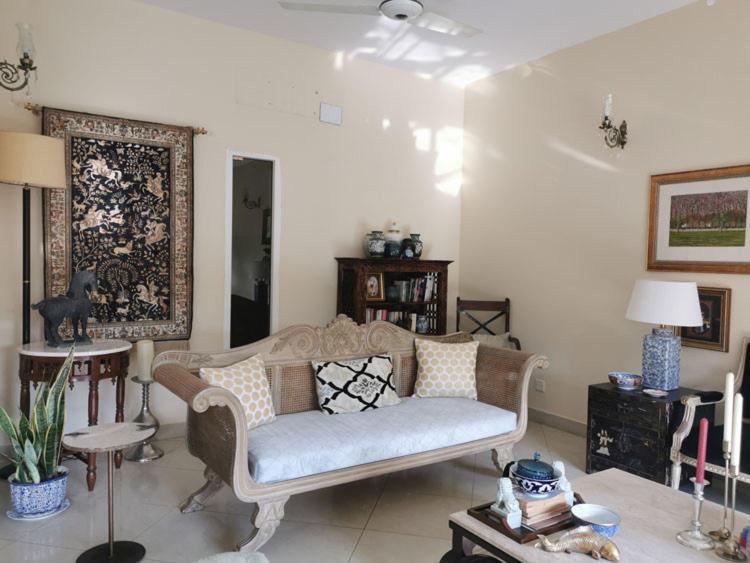 a living room with a couch and a table at Aizaz Villa in Peshawar