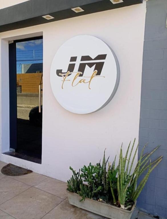 a sign on the side of a building at JM Flat 1 in Petrolina