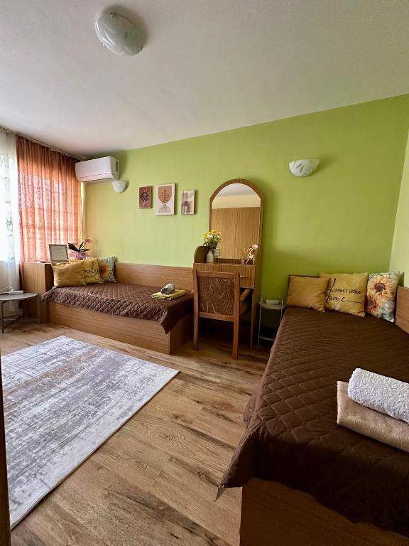 a living room with a couch and a table at Radetsky Apartment with FREE Private Parking in Haskovo