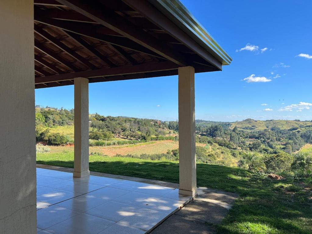 a porch of a house with a view at Mar Azul in Espirito Santo Do Pinhal