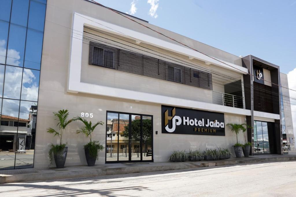 a building with a photo lab sign on the side of it at Hotel Jaiba Premium in Terra Fôfa