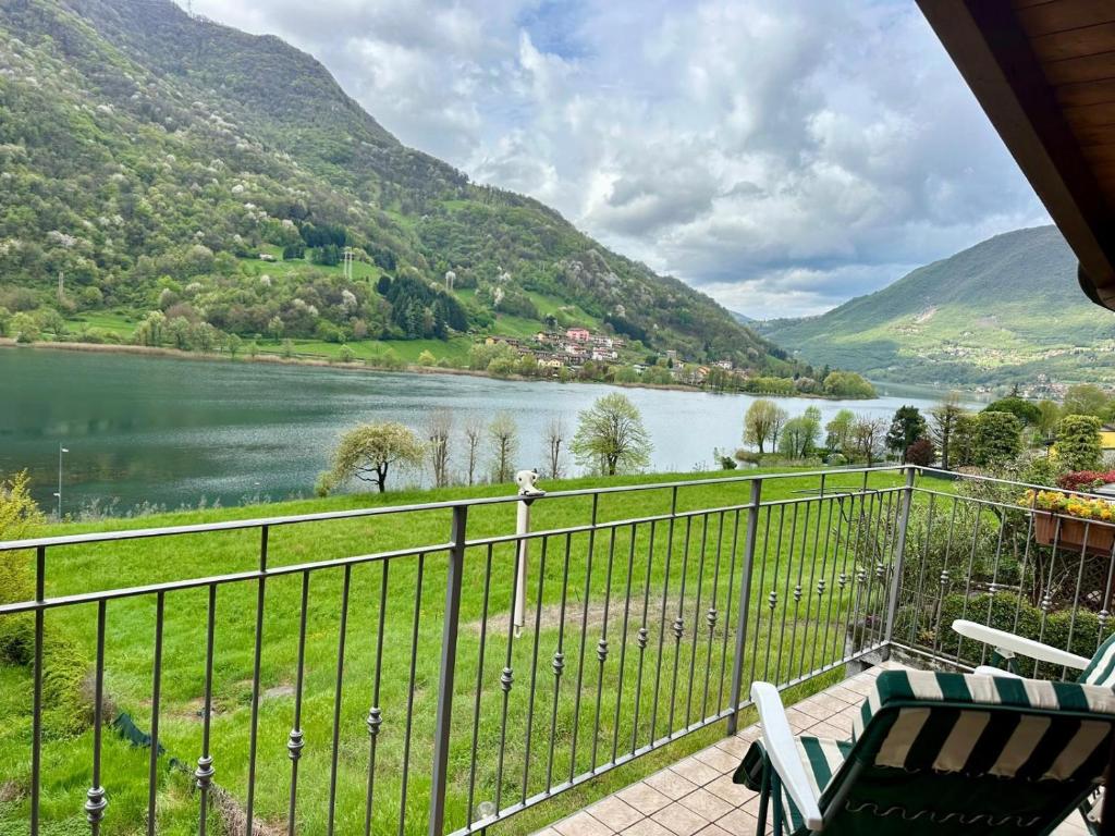 a balcony with a view of a lake and mountains at Casa Candiotty Lake & Mountain in Endine Gaiano