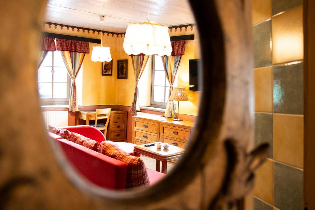 a living room with a couch and a table at Apartments Belopeški Dvori in Kranjska Gora