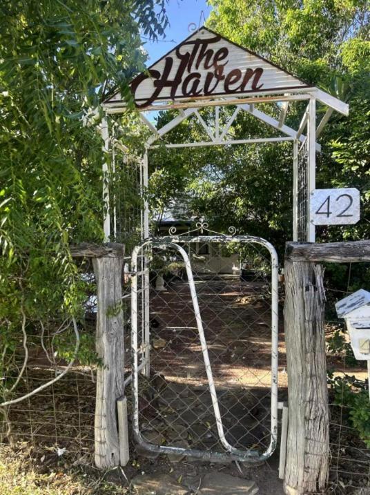 a gate with a sign that reads the farmer at The Haven in Blackall